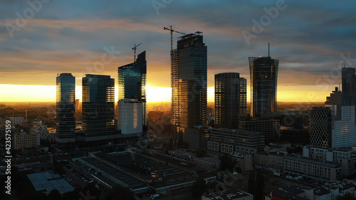 Astonishing red sunset over the Poland skyscrapers. Warsaw at night  aerial . High quality photo