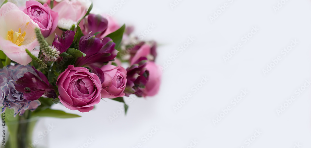 Fototapeta Pink, burgundy and white flowers - tulips, alstroemeria, roses, carnations, chrysanthemums in a bouquet on a white background. Greeting card, floral banner, copy space