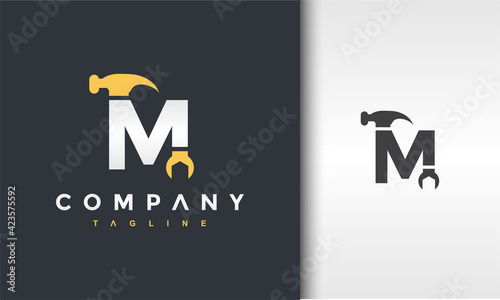 letter M hammer wrench logo