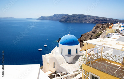 Oia village Santorini. With blue Church domes and white washed houses on the Island of Santorini  Greece.