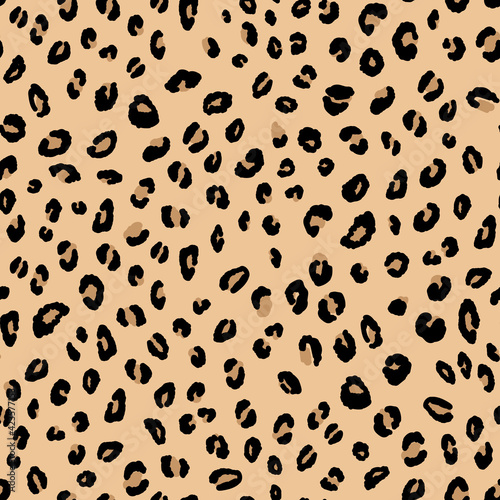 Abstract modern leopard seamless pattern. Animals trendy background. Beige and black decorative vector stock illustration for print, card, postcard, fabric, textile. Modern ornament of stylized skin