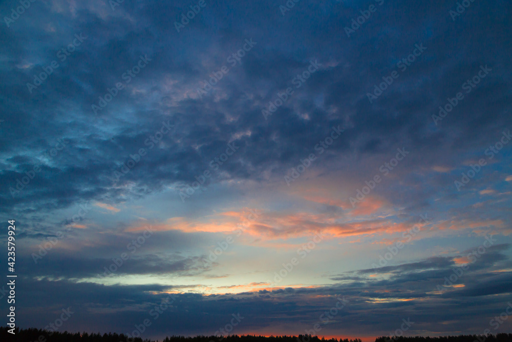 Panorama of the sky with beautiful colored whimsical clouds