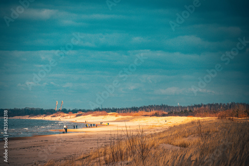 Sea coast with silhouttes on sand Jurmala