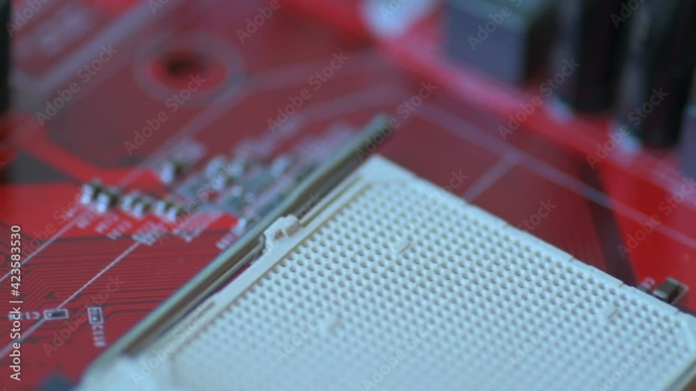 Red board with chips and microcircuits in slow motion Red board with chips and microcircuits in slow motion