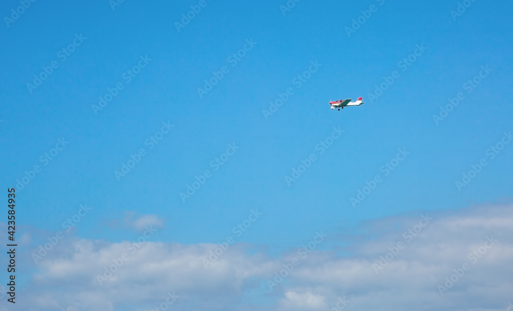 light single-engine aircraft soaring above light single-engine aircraft soaring above