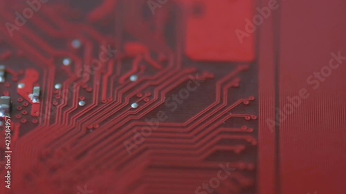 Bright red chip board moves in slow motion.