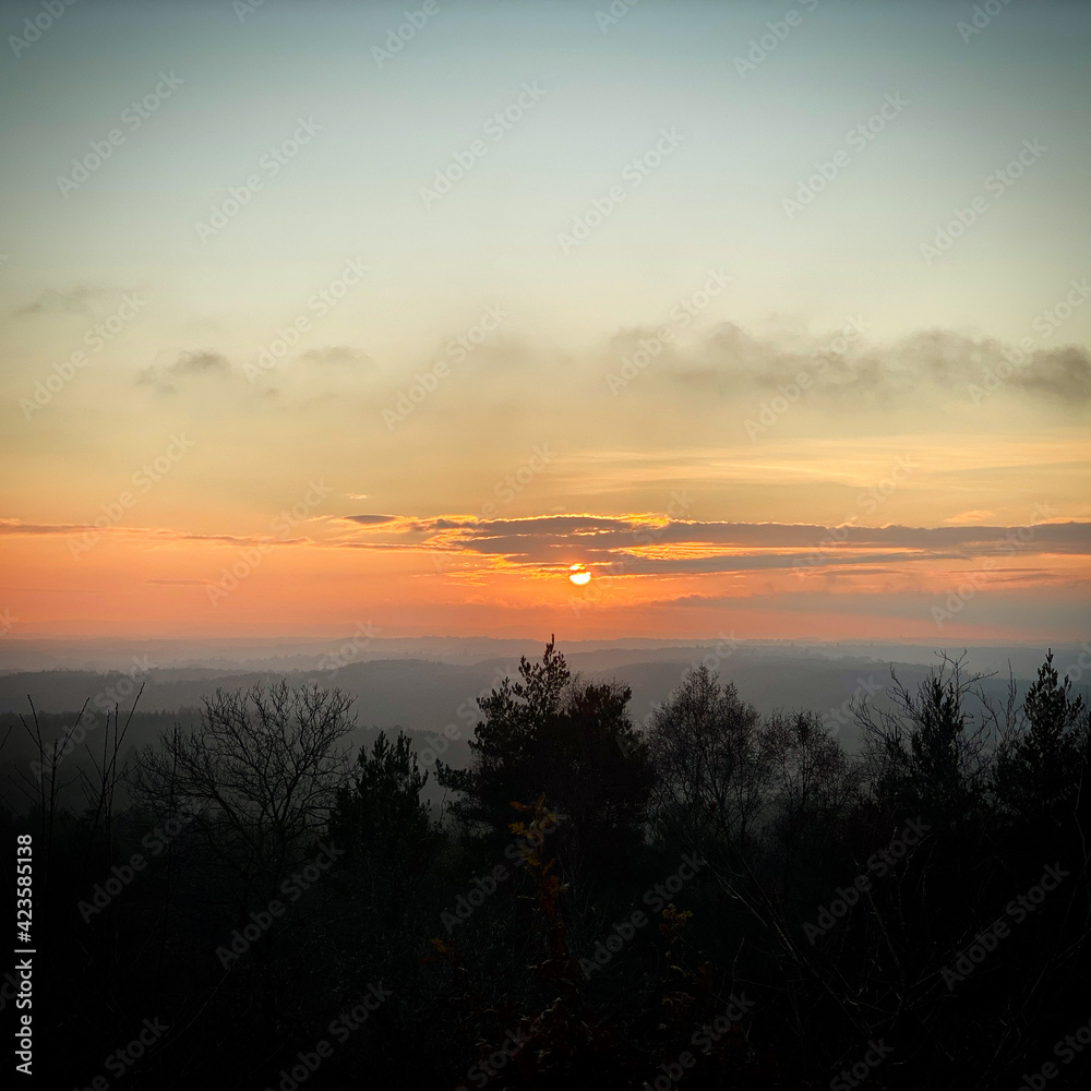 Fototapeta premium Surrey Sunset looking over the hills 