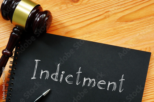 Indictment is shown on the conceptual photo using the text photo
