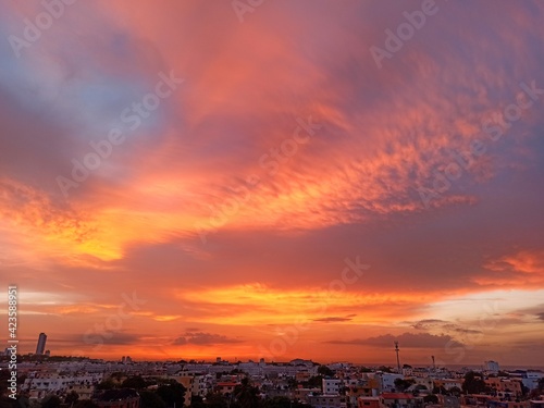 sunrise over the city with sahara dust © Genny