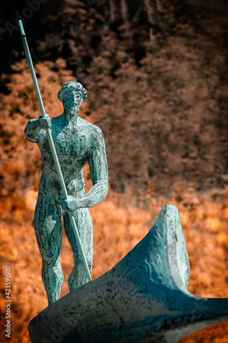 Charon in the boat (in Greek mythology) - the carrier of souls of the dead across the River Styx (Acheron) in Hades (the underworld the dead).