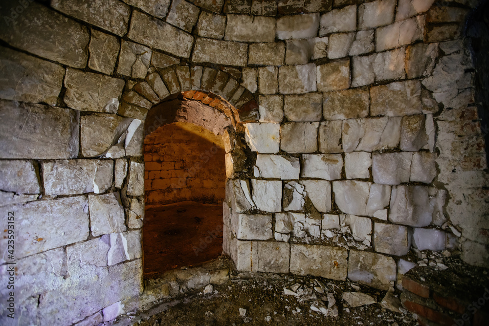 Abandoned empty old underground round cellar under rural house