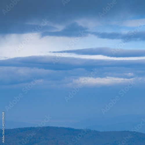 Clouds above carpathian mountains in evening 