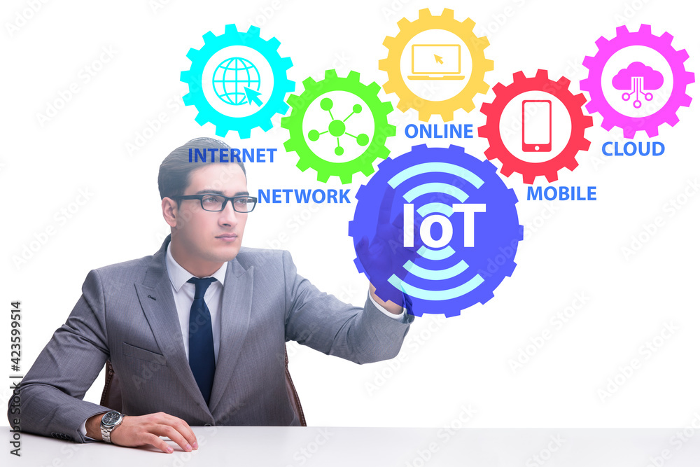 Businessman pressing virtual button in IoT concept Businessman pressing virtual button in IoT concept