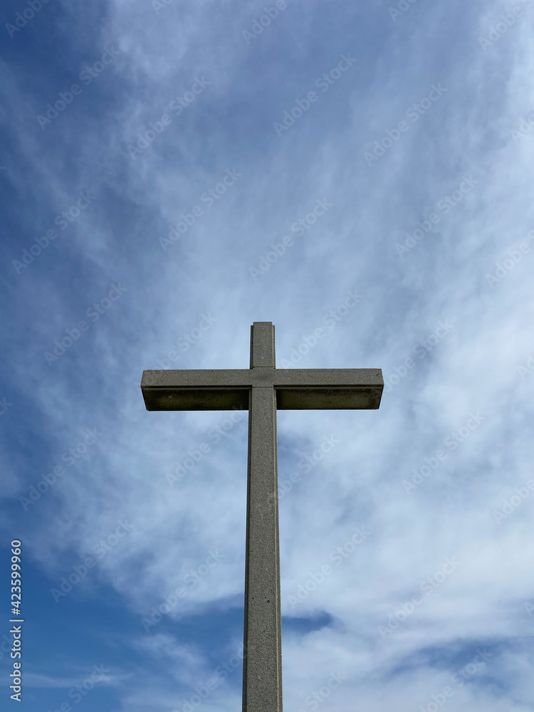 A Stone Cross (Cruzeiro) at the entrance of the Saint Bartholomew of the Sea beach in the parish of Mar, municipality of Esposende, North of Portugal.