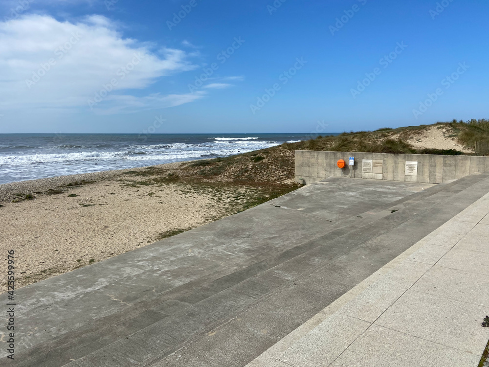 Mar, Esposende, Portugal, March 27, 2021: The entrance of the Saint Bartholomew of the Sea beach in the parish of Mar, municipality of Esposende, North of Portugal. Mar, Esposende, Portugal, March 27, 2021: The entrance of the Saint Bartholomew of the Sea beach in the parish of Mar, municipality of Esposende, North of Portugal.