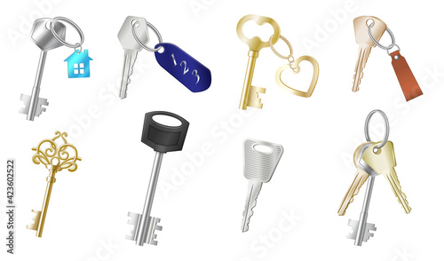 Set of realistic keys with different keychains on white background isolated. Keyholders and keyrings