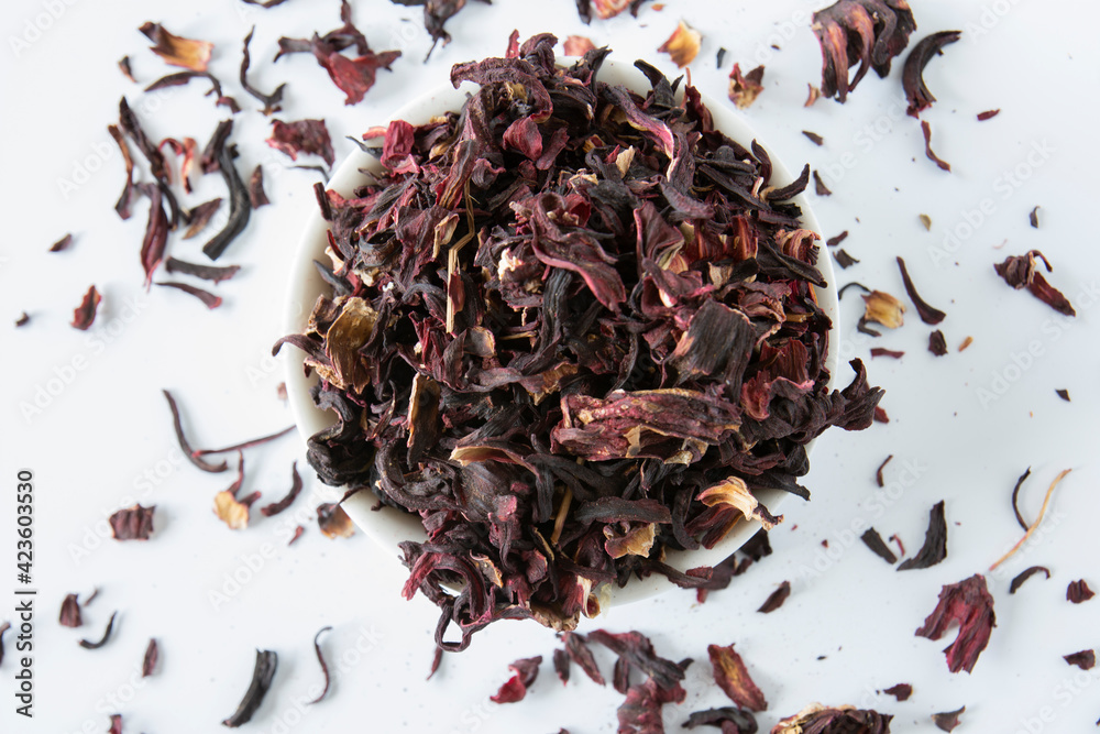 Obraz premium Detox drink dried pomegranate flower tea. increases immunity. Pile of nasr flowers in tabk with selected focus.