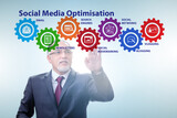 Social media optimisation concept with businessman