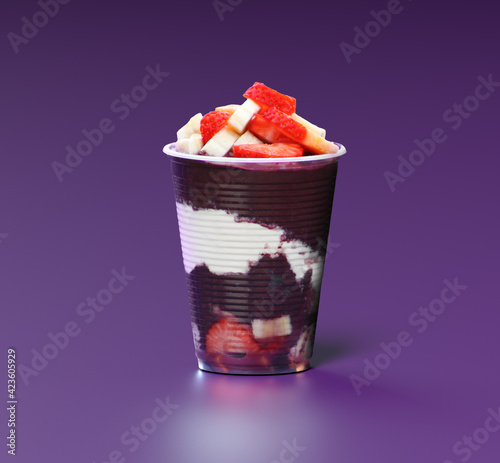 Cup of Açaí with strawberry and banana on a purple background