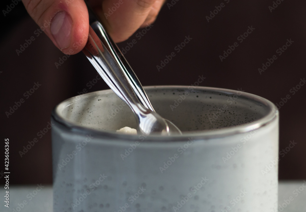 hand pouring milk into glass hand pouring milk into glass