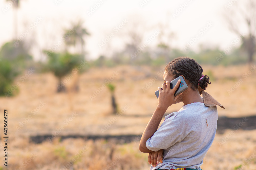female african farmer making a phone call female african farmer making a phone call