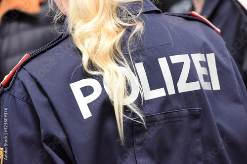 Polizistin von hinten in Österreich - Female police officer from behind in Austria photo