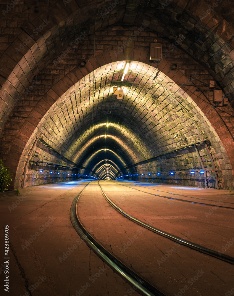 Illuminated Tramway Tunnel at Night in Bratislava, Slovakia