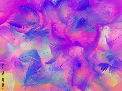 Colorful feather. Bright abstract background made of bird plumage. Close-up of a neon-colored feather. Soft Focus