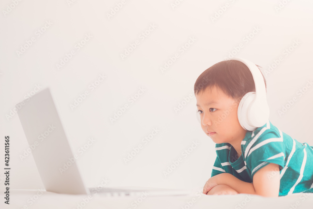 E-learning, online education at home.Online education.Distance learning, Asian kid child school boy online learning with laptop.Smart kid listen teacher talk.Success, programing, homeschool Student. E-learning, online education at home.Online education.Distance learning, Asian kid child school boy online learning with laptop.Smart kid listen teacher talk.Success, programing, homeschool Student.