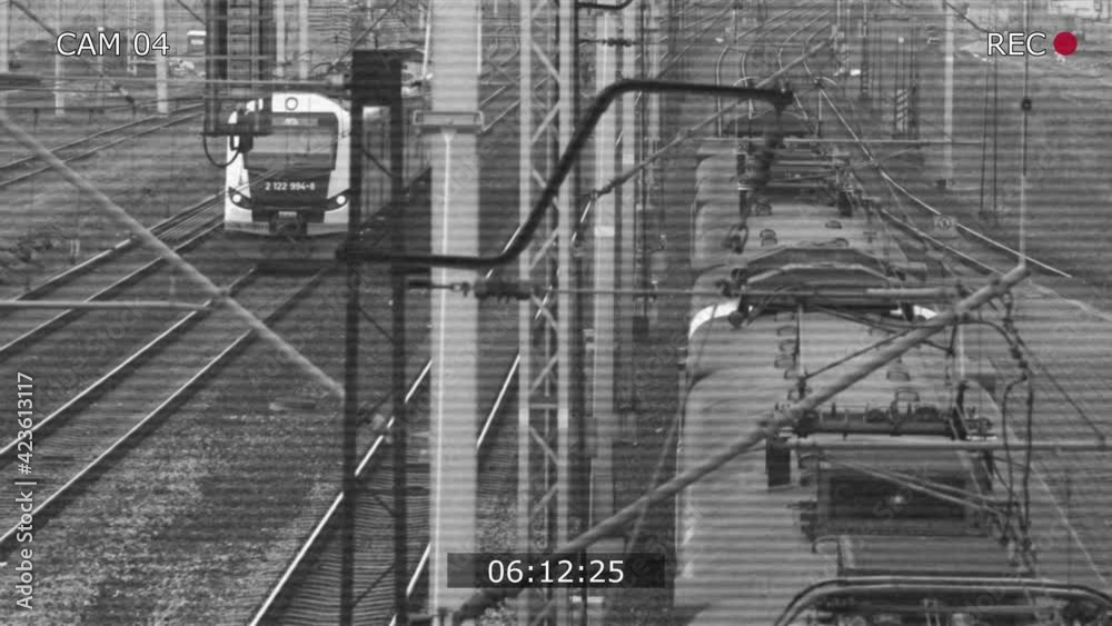 CCTV Security Camera view of Electric Passenger Train on Multiple