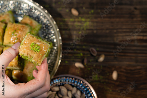 Traditional Turkish Ramadan dessert - baklava with pistachios (Turkish: fistikli baklava). Eid mubarak.  Ramazan bayrami. Ramadan kareem. photo