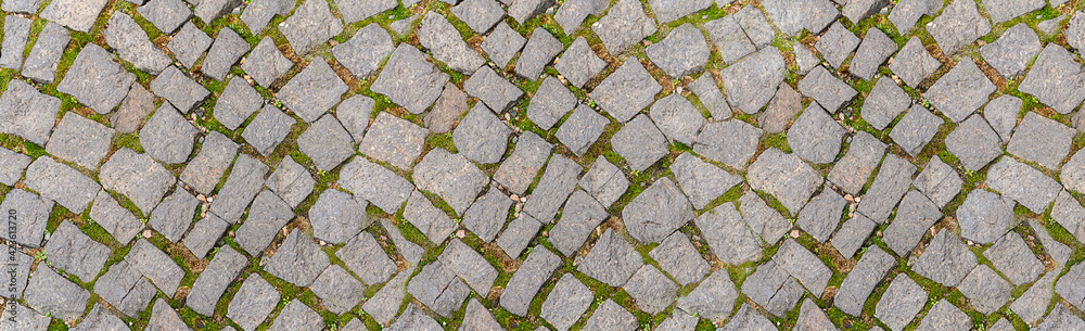 texture old gray cobblestone road of a medieval town texture old gray cobblestone road of a medieval town