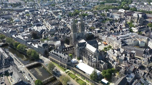 Aerial view of center of Quimper on banks of Odet River overlooking of Cathedral of Saint Corentin in summer, Finistere, France photo