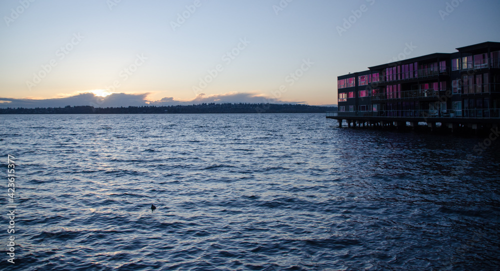 Glowing pink highlights for condo building during sunset in Kirkland