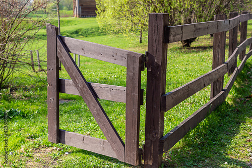 wooden gate entrance to the farm, open wooden gate