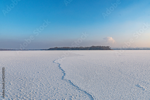 Winter landscape on a frozen river.