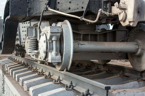 Carriage bogie, perspective view. The main element of the carriage running gear, close-up. A wagon bogie on a railway track. Fragment of the railroad track.