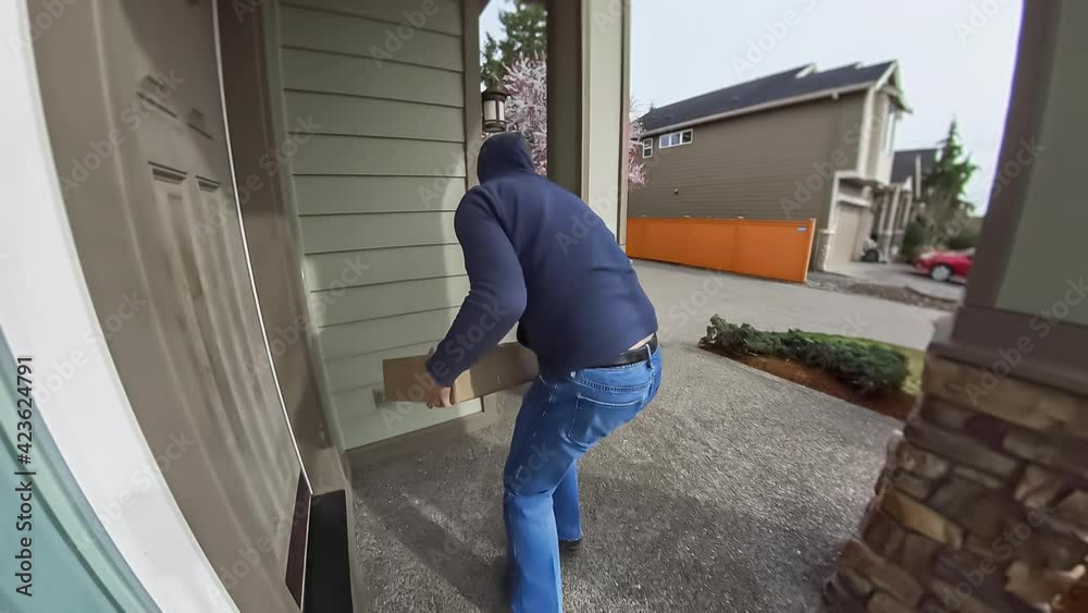 Package thief caught on home security camera in hoodie, sunglasses and ...