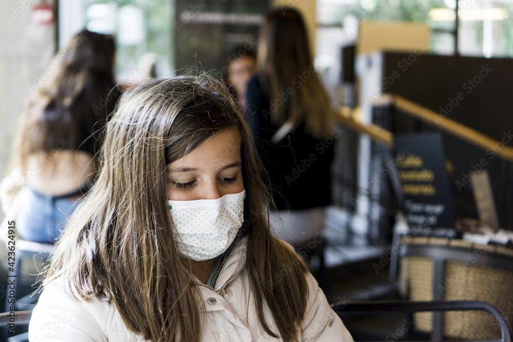 girl having a snack in a cafeteria