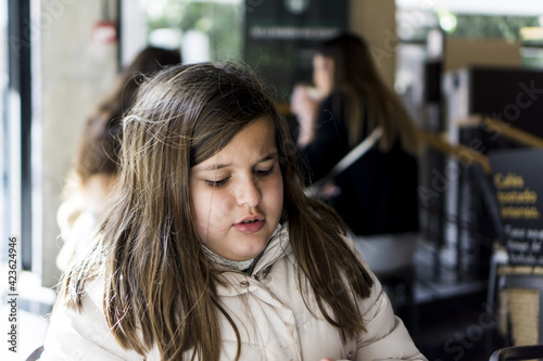 girl having a snack in a cafeteria