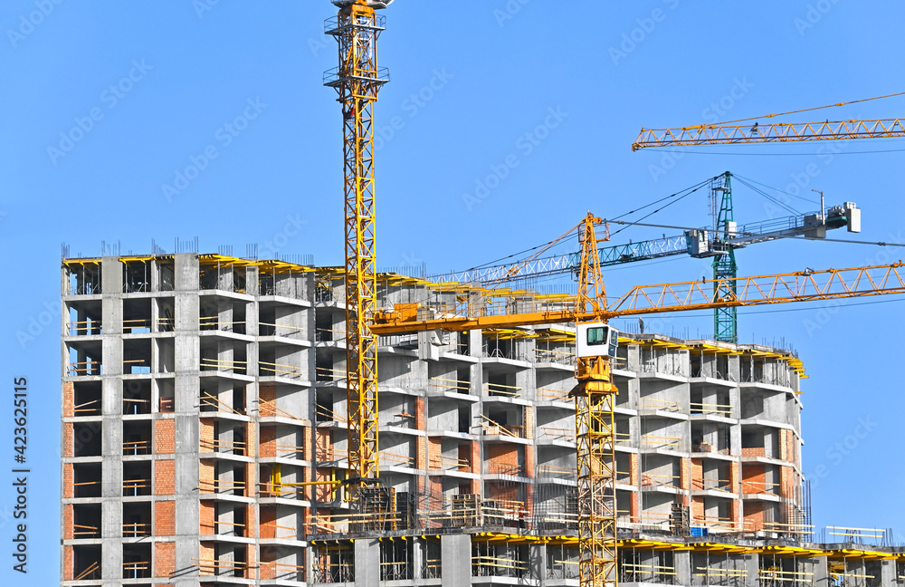 Crane and highrise construction site