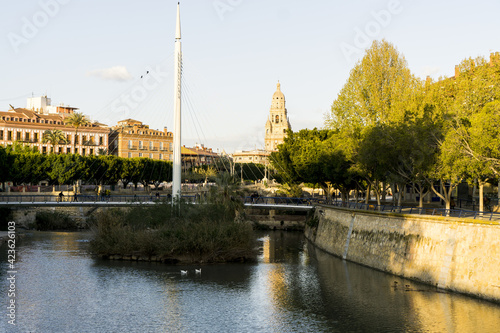 beautiful views of the river segura, with the cathedral of murcia in the background.