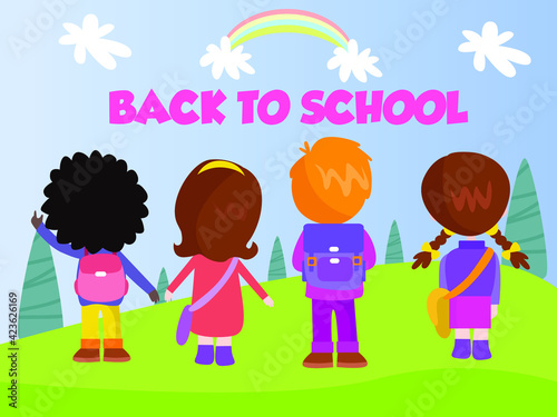 Primary school students standing at the park while looking at the back to school text and rainbow on the sky