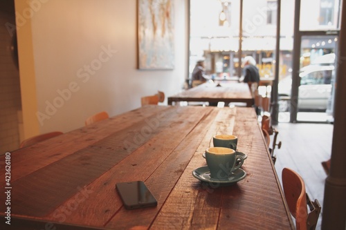 Two hot cups of coffee in winter