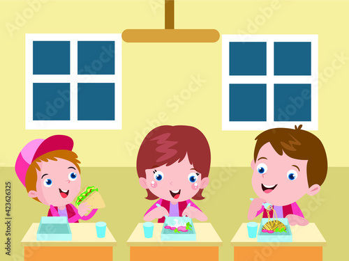 Three elementary school students having lunch together in the school canteen