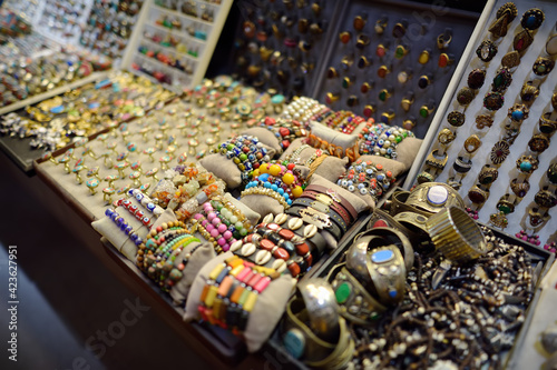 Wallpaper Mural Showcase for sales of jewelry and bijouterie on Istanbul grand bazaar marketplace. Rings, earrings, bracelets and other - traditional gifts from travels by Turkey. Torontodigital.ca