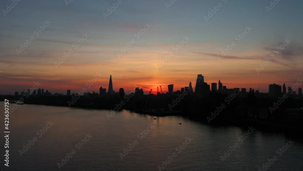CINEMATIC ROTATION CITY REVEAL AERIAL AT SUNDOWN WITH AMAZING SKIES. CINEMATIC ROTATION CITY REVEAL AERIAL AT SUNDOWN WITH AMAZING SKIES.