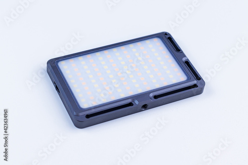 Small-sized LED lamp for photo and video production. Soft focus.