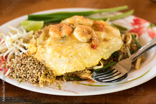 Pad Thai with fresh prawns and fried omelettes, a popular Asian dish.