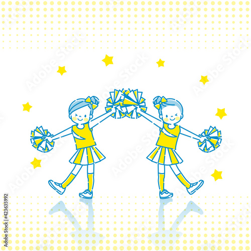 笑顔でチアダンスをしている子供たち